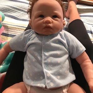 An Ashton drake doll ,no marks, real parts